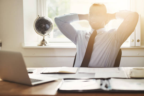 istock Content young businessman leaning back in his office chair 862298264
