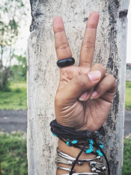 istock Victory sign with bracelet 862299018