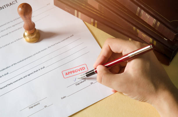 istock Notary signing a contract with fountain pen 862302596