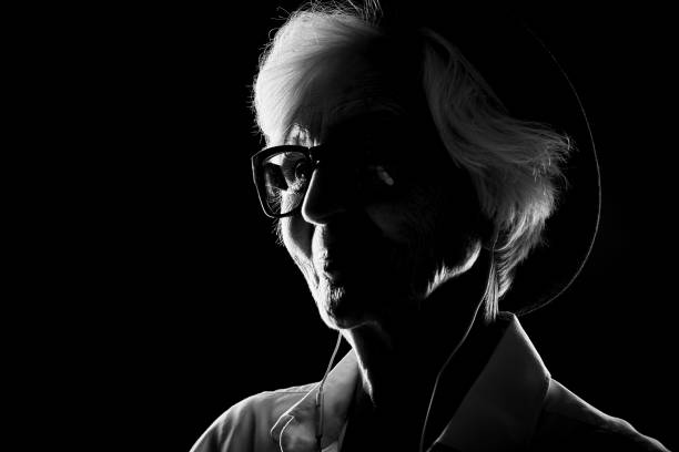 istock Modern old woman in earphones 862306350
