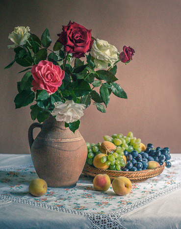 Still life with flowers and fruits.