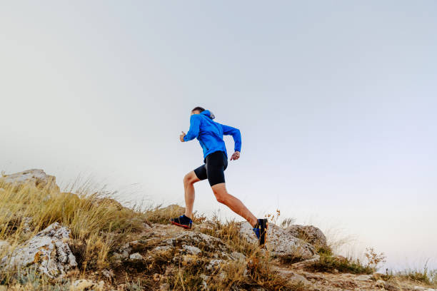 istock running uphill on stones male athlete runner side view 862317968