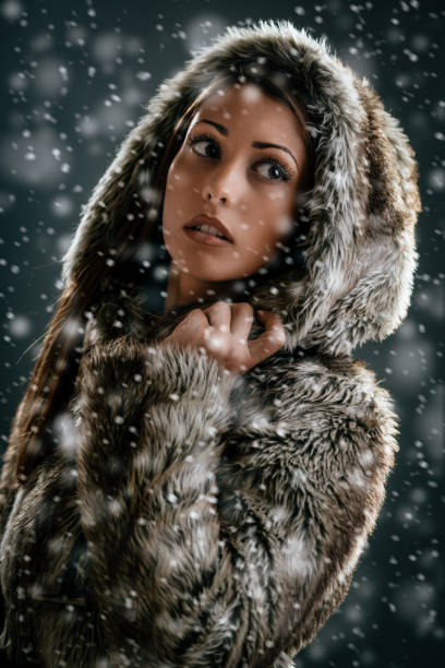 istock Girl Is Looking Through Snowflakes 862320830
