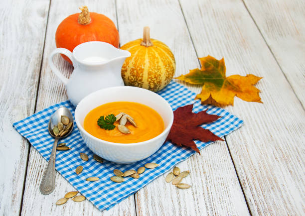 istock Pumpkin soup with fresh pumpkins 862320942