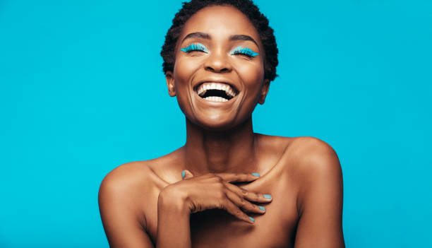 istock Cheerful young woman with vibrant makeup 862321402