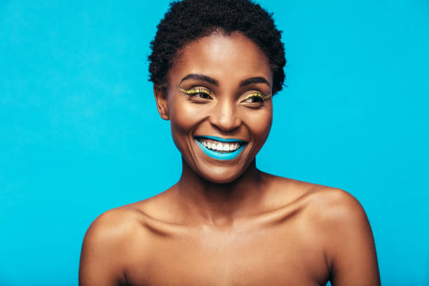 istock Smiling african woman wearing vivid makeup 862321716