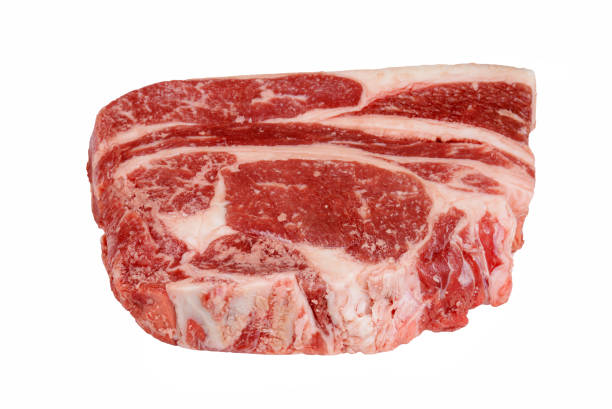 isolated closeup raw ribeye steak on white background