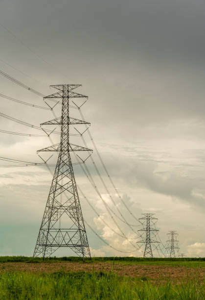 istock high voltage pole, big cloud on outdoor landscape, copy space. 862324486