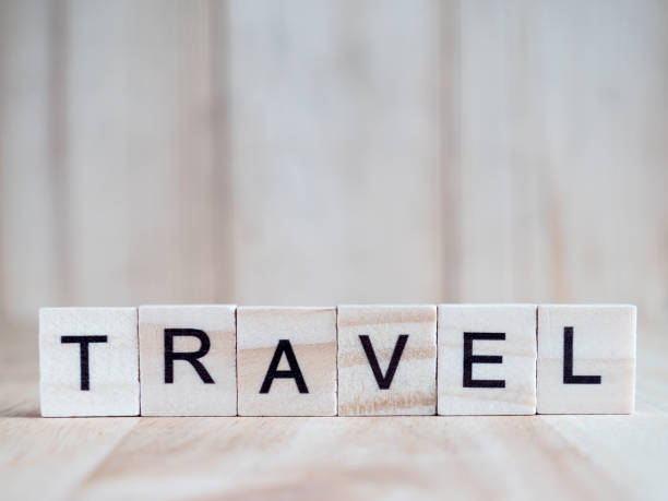 istock Word spell Travel on wooden background 1 862324964