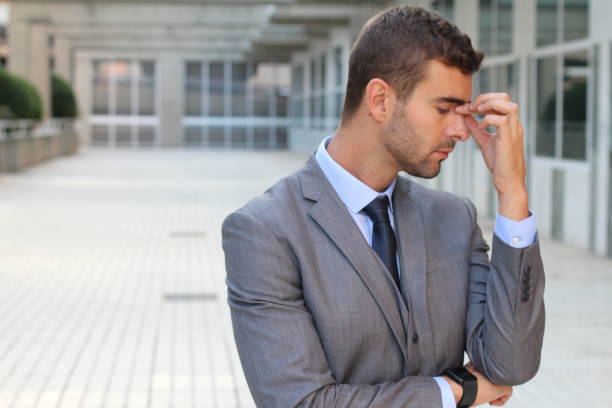 istock Man with sinusitis isolated in office space 862326136
