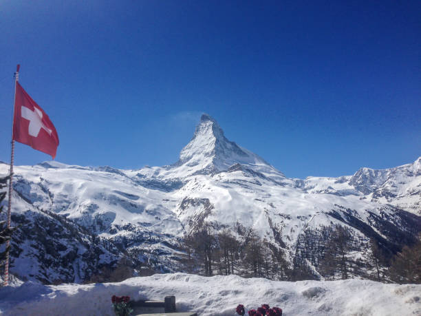istock Matterhorn with swiss flag 862326342