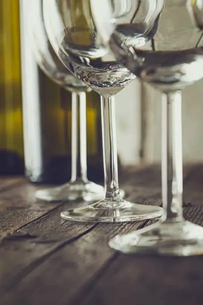 Wine. Empty wine glass. in wine cellar. Old white wine on wood.Arranged wine glasses