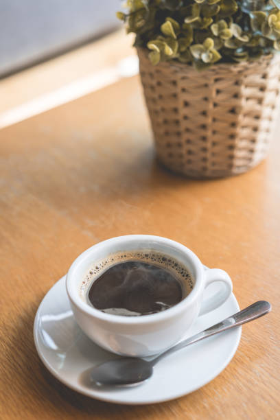 istock Coffee white cup , Black coffee on wood table ,warm and good smell 862337444