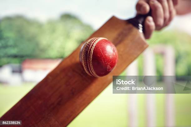 Cricket Player Hitting Ball Stock Photo - Download Image Now - Sport of Cricket, Cricket Bat, Sport