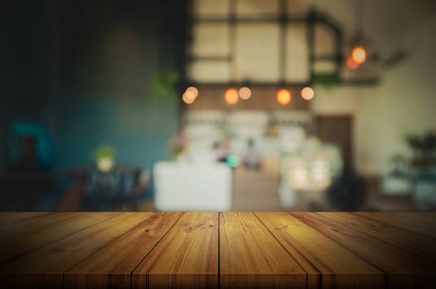 istock Empty wooden table top with blurred coffee shop or restaurant interior background. can be used product display. 862347296