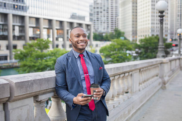 istock Happy businessman using phone in downtown Chicago 862347472