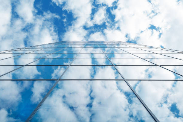 istock modern business high rise glass building and blue sky with clouds 862347476