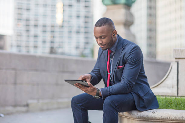 istock Businessman using digital tablet in downtown Chicago 862347494