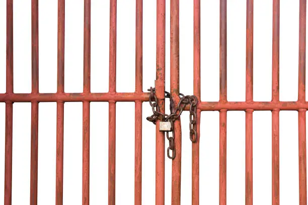 Photo of Orange Cage door with chain and lock isolate on white background