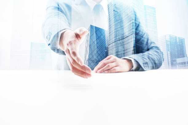 istock Businessman Giving Handshake with Double Exposure Cityscape 862348056