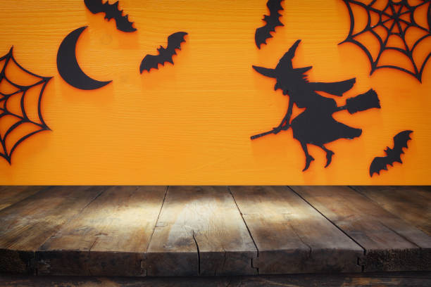 istock Halloween holiday concept with empty rustic table over orange background. Ready for product display montage 862350434