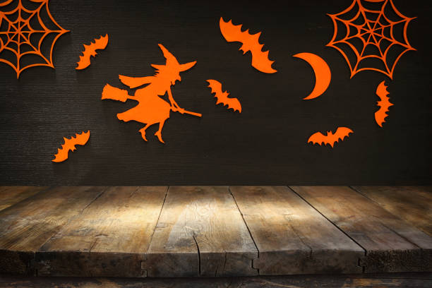 istock Empty rustic table in front of Halloween holiday background. Ready for product display montage 862350450