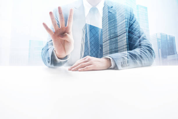 istock Businessman Doing Number Four Hand Sign with Double Exposure Cityscape 862350514
