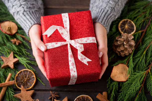 istock Woman hands making Christmas day gifts. 862356056