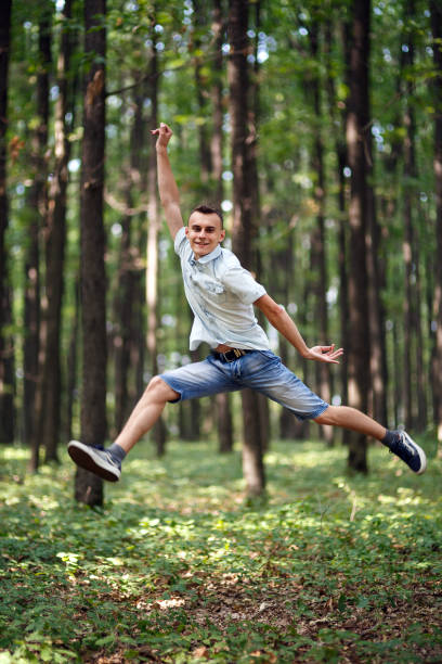 istock Jumping for joy in the park 862359136