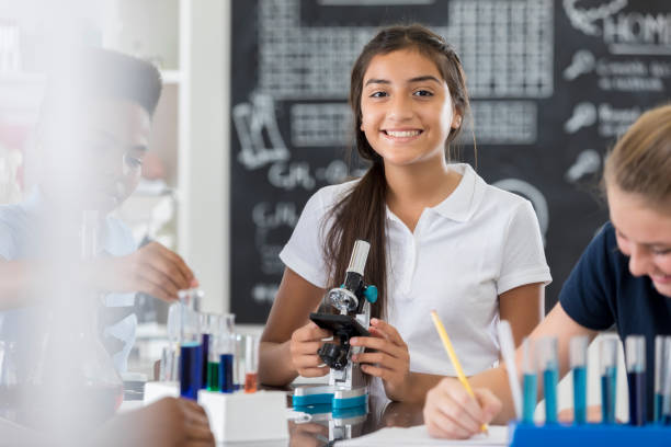 istock Confident middle school girl in science lab 862362312