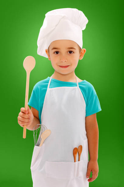 istock Little chef showing wooden spoon 862362512