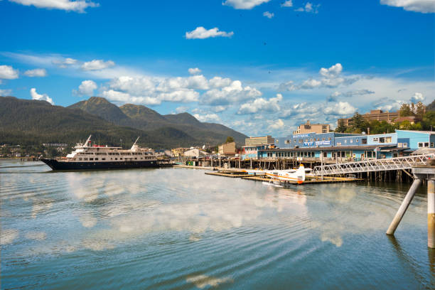 Juneau port with prop plane JUNEAU, ALASKA- SEPT 3, 2017: Juneau Pier where it is busy with with sea planes and big cruise ships. Juneau is the capital of Alaska. juneau stock pictures, royalty-free photos & images