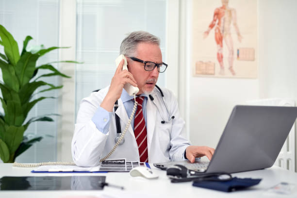 istock Doctor talking on the phone in his studio 862367258