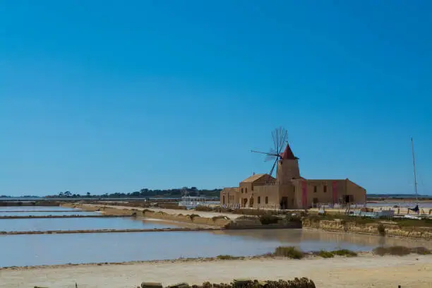 Sea salt production , salt wind mills are seen in suburbs of Marsala, Sicily, Italy.