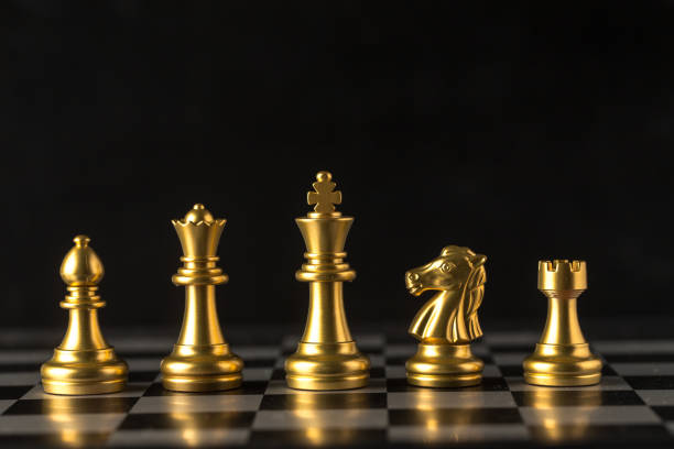 istock Chess on a chessboard at black background, Business leader concept. 862371412
