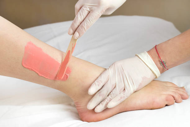 istock Process depilation female legs and hands 862378542