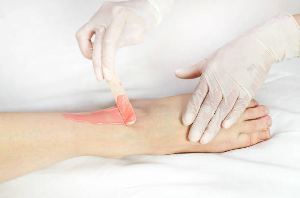 istock Process depilation female legs and hands 862378636