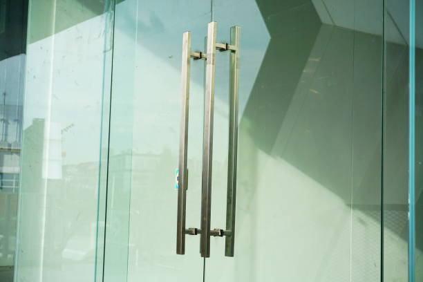 Door Handles on a Glass Office Building Office, Aluminum, Chrome, Iron - Metal, Key sliding door stock pictures, royalty-free photos & images