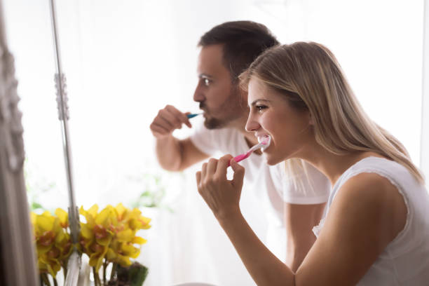 istock Attractive couple washing teeth in morning together 862382990