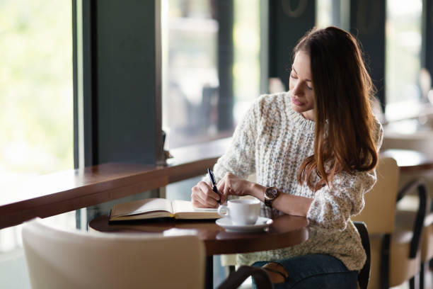 istock Beautiful woman drinking coffee in restaurant alone 862385066