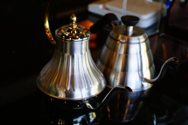 istock pouring hot water in frech press coffee maker 862385602