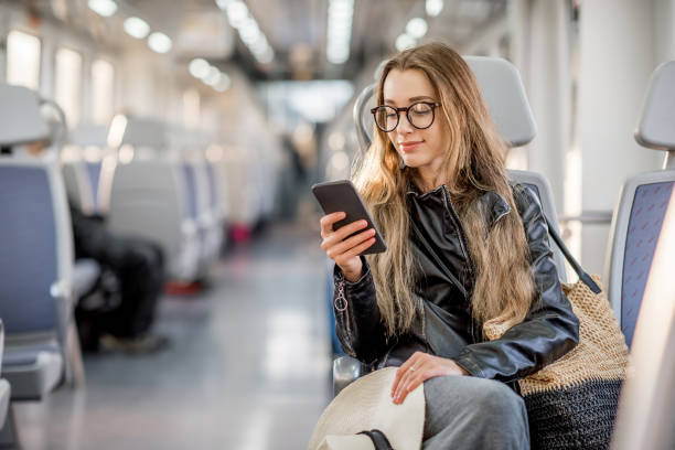 donna in sella al treno moderno - pendolare foto e immagini stock