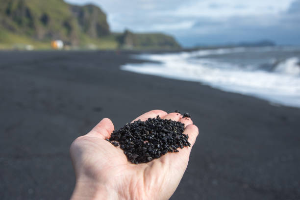 istock Icelandic volcanic sand on the hands. Vik, Iceland 862396632