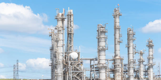Oil refinery column un er cloud blue sky in Pasadena, Texas, USA