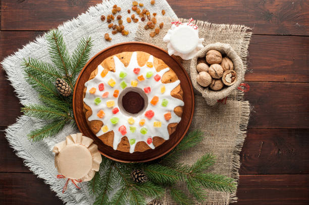 istock traditional decorated christmas cake at wooden table 862397696