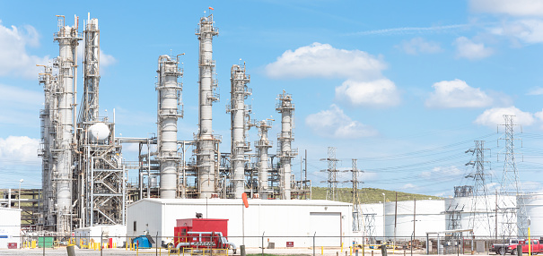 Oil refinery, oil factory, petrochemical plant in Pasadena, Texas, USA under cloud blue sky. Panorama style.