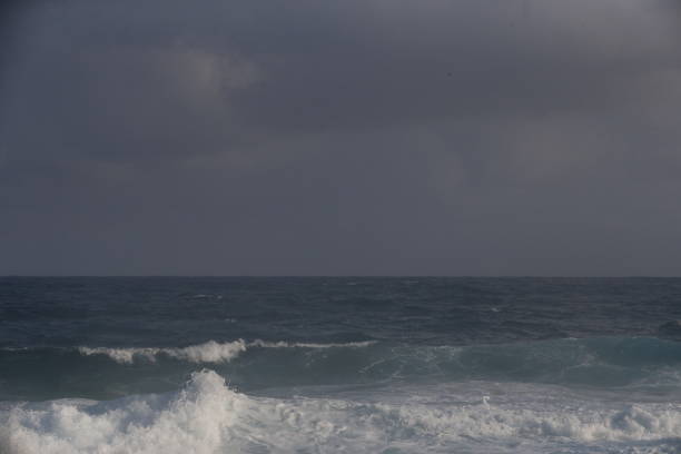 istock Waves breaking at Shipwrecks Beach in Kauai, Hawaii 862398106