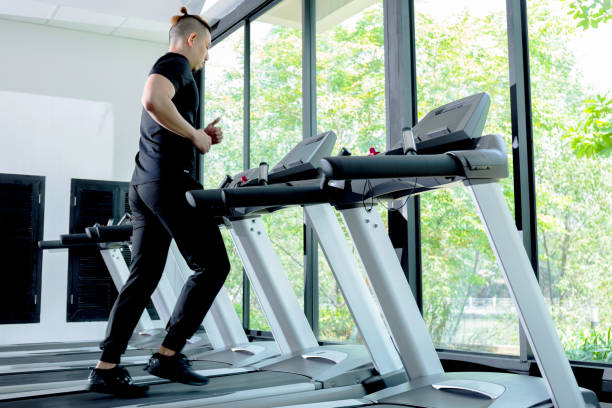 istock Healthy man Running on Treadmill. 862401444