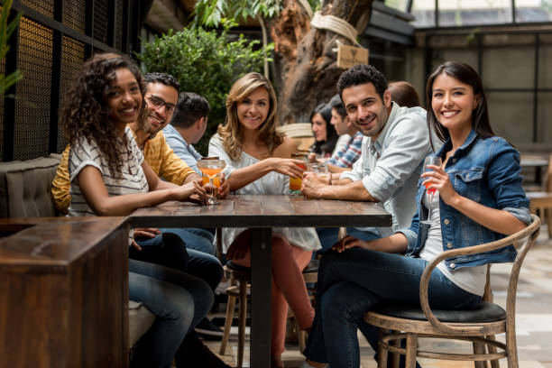 istock Happy group of friends having dinner at a restaurant 862404146