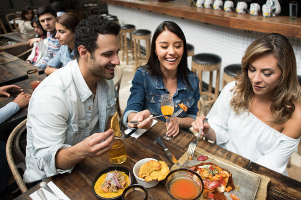 istock Happy friends eating at a restaurant 862404162